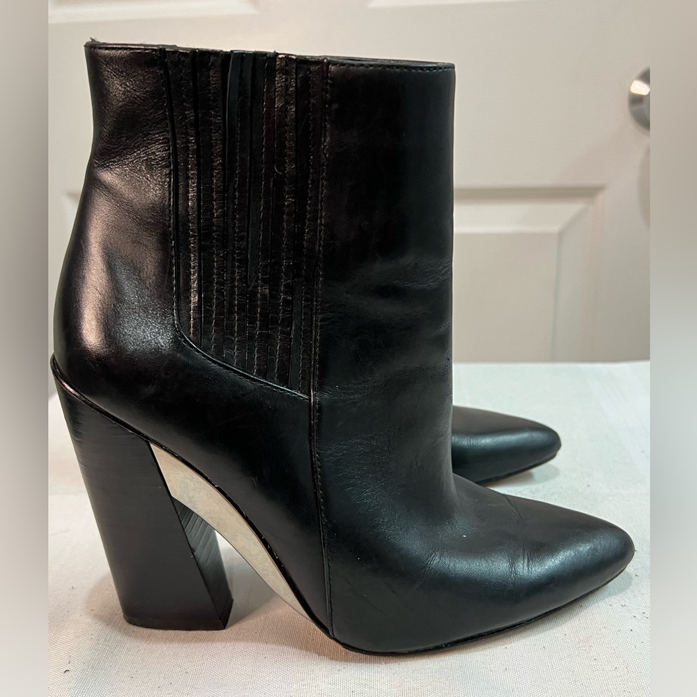 BCBG Maxazria black leather pull on heel booties. Size 6M